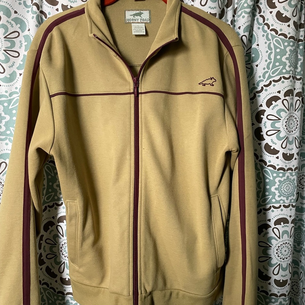 Horny Toad Warm up Jacket in light olive with purple detail.
